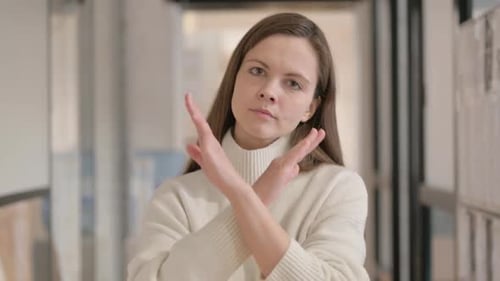 Young Adult Woman Gesturing No With Her Arms