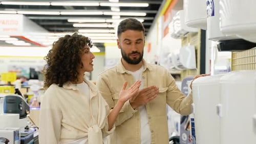 Couple Choosing Air Conditioner in Appliance Store