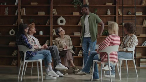 Diverse Group Discussion in Therapy Office