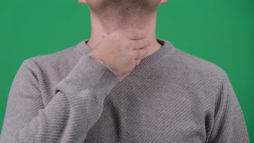 Adult Massaging Neck with Green Screen Background