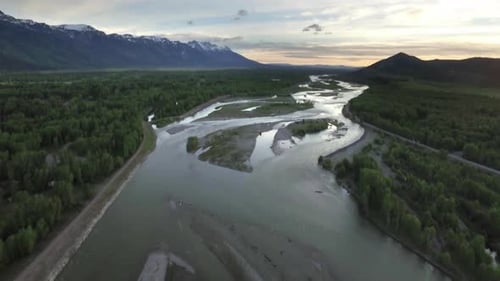 Drone View Of Sunset Sky With Snowcapped Mountains And River 5