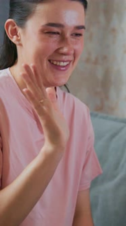 Smiling Woman Playing with Toddler Indoors