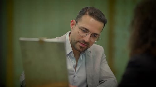 Two Professionals on a One on One Meeting Inside the Vault Room