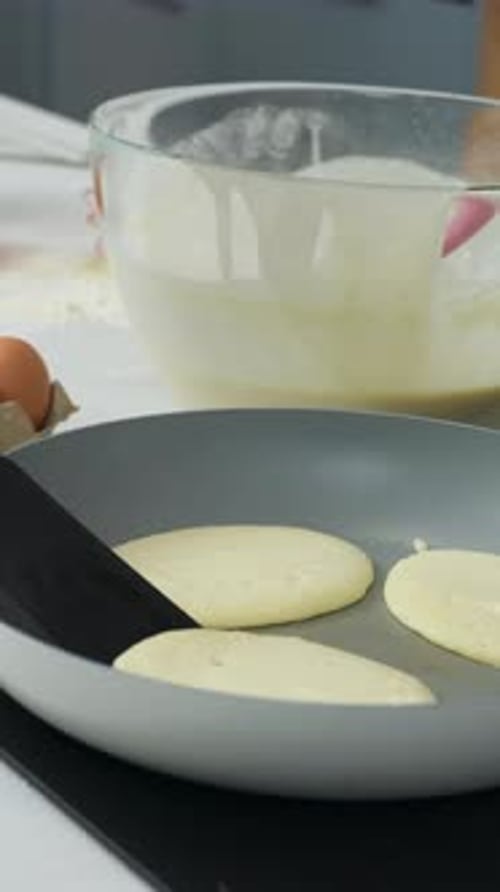 Vertical View Of Homemade Pancake Cooking In A Pan. Close-up Shot