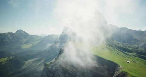 Seceda peak shrouded by clouds, Dolomites, Italy