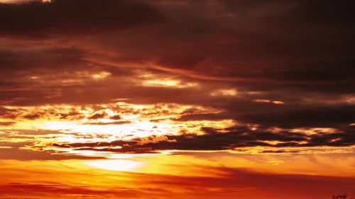 Dramatic Sunset Sky with Clouds and Sunlight