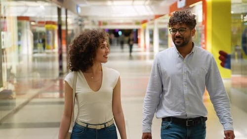 Happy Couple Walking in Mall Gallery