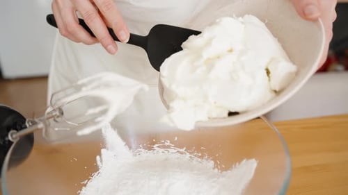 Adding Cream to Bowl for Baking Preparation