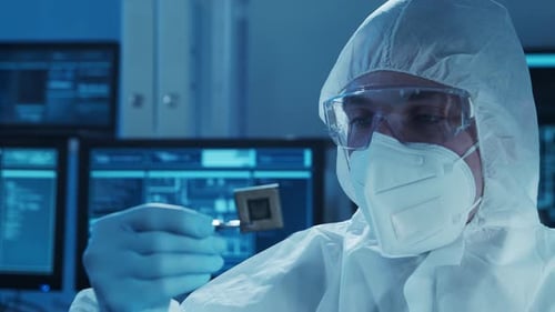 Microelectronics Engineer Works in a Modern Scientific Laboratory on Computing Systems Electronic