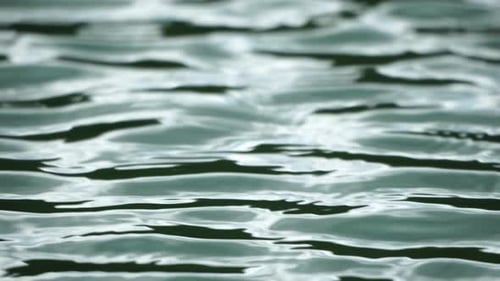 Sun Reflecting on Sparkling Sea Lake Water Surface Ocean at Sunset Sunrise Sunrays Flickering in