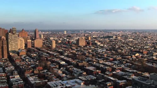 Establishing shot, Modern American urban city at sunset, golden color reflects of tall skyscrapers,