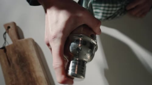 Bartender Shaking a Cocktail Shaker, Close Up