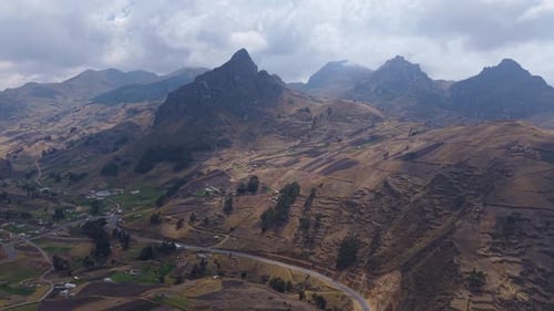 Andean Mountain Slopes Showcasing Landscape Winding Roads and Agricultural Terraces Human Resilience