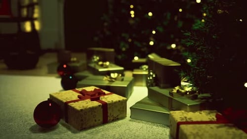 Closeup of Gift Packages Under Holiday Decorated Christmas Tree