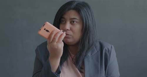 Woman Talking on Phone With Voice to Text