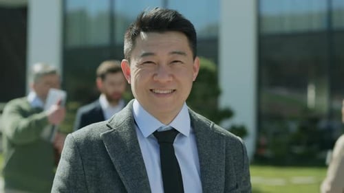 Smiling Businessman in a Modern Urban Setting