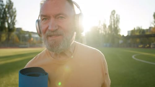 Old Caucasian Man Walking Stadium City Outside Mat Sportive Equipment Training Sportsman in