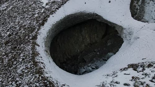 Aerial View of a Cave in a Glacier Caused By Melting