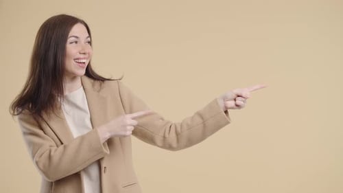 Happy Brunette Woman Pointing to the Right Side