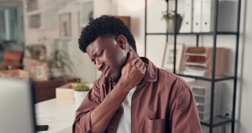 Business, black man and massage neck pain in office from bad posture, muscle strain and burnout