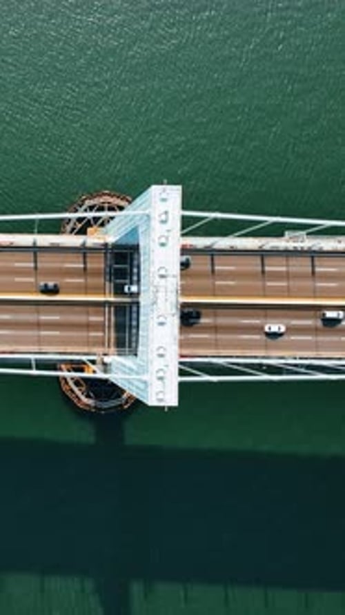 Descending over the powerful support of a suspension bridge.