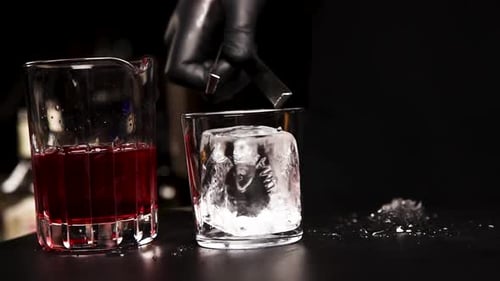 the bartender prepares a cocktail at the bar