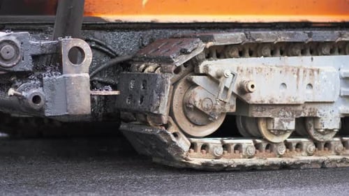 Tracked Paver Machine During Asphalt Pavement Works for Road Repairing in Berlin