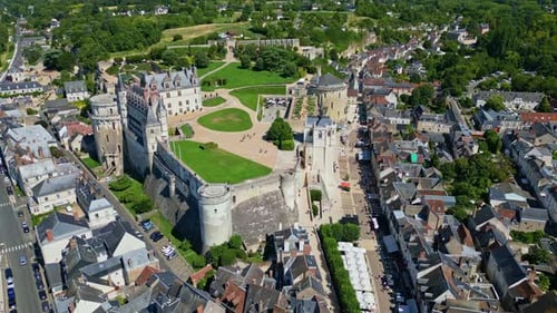 Aerial view of Chateau Royal d'Amboise showcasing its stunning architecture, surrounded by gardens