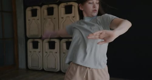 Portrait of Flexible Young Lady Dancing Alone Enjoying Individual Practice in Studio