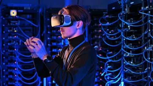 Man using Virtual Reality headset in a server room