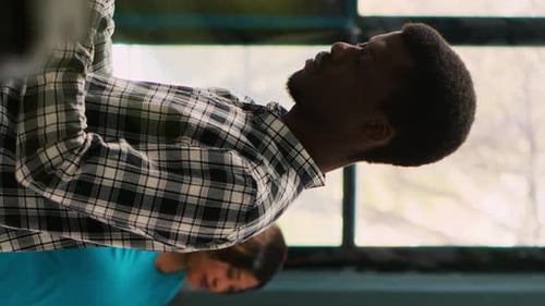 Young Adult Smiling and Looking at Camera Indoors