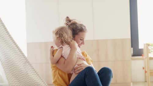 Loving Mother Playing with Child at Home