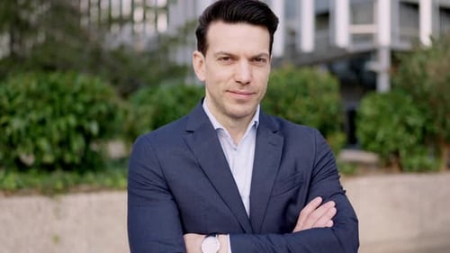 Handsome Man in Blue Suit with Arms Crossed