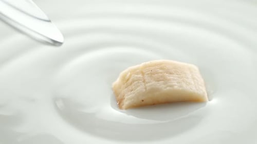 Banana Piece with Yogurt on Spoon