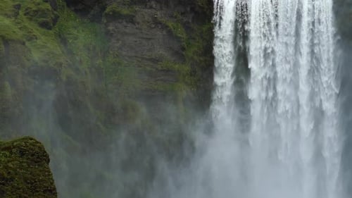 Biggest Waterfalls In Iceland With Skógafoss Flowing From The Steep Mountains. Slow Motion