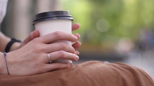 Person Holding Coffee Cup Close Up