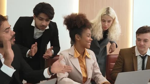 Diverse group of office worker and employee celebrate in ornamented office