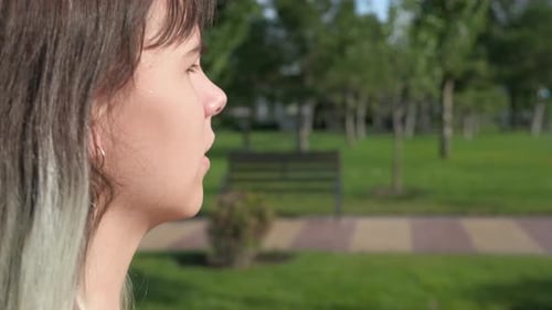 Teenage Holds Asthma Inhaler in Hands