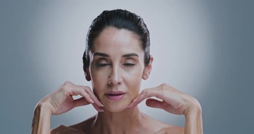 Face, skincare and mature woman in studio for wellness, beauty and facial treatment for anti aging