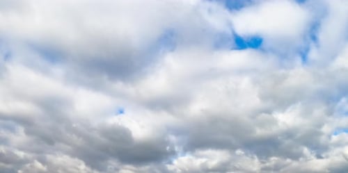 Light high clouds sliding on the sky. Layer of clouds on blue sky moving.
