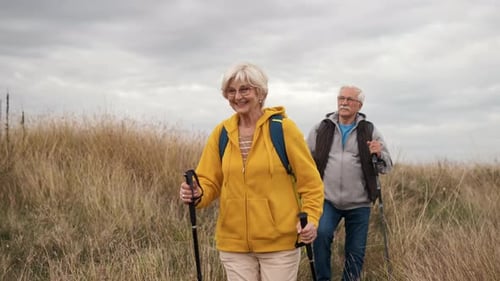 Active Senior Couple Hiking on Overcast Day