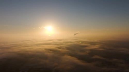 Aerial View Above Clouds at Sunrise