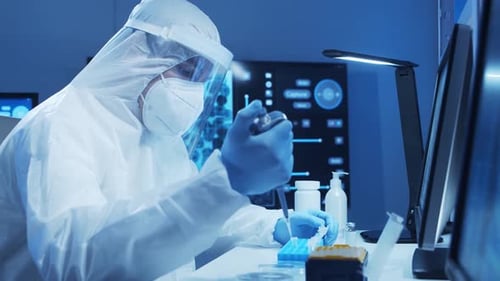 Scientist in Hazmat Suit Conducting Medical Research