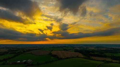 Timelapse Sunset Over Countryside Fields with Moving Clouds Time Lapse Glowing Evening Sky Shifting