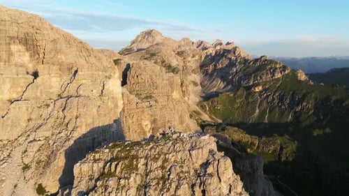 High-flying drone shot capturing the intricate textures of the Dolomites, from its deep crevices to
