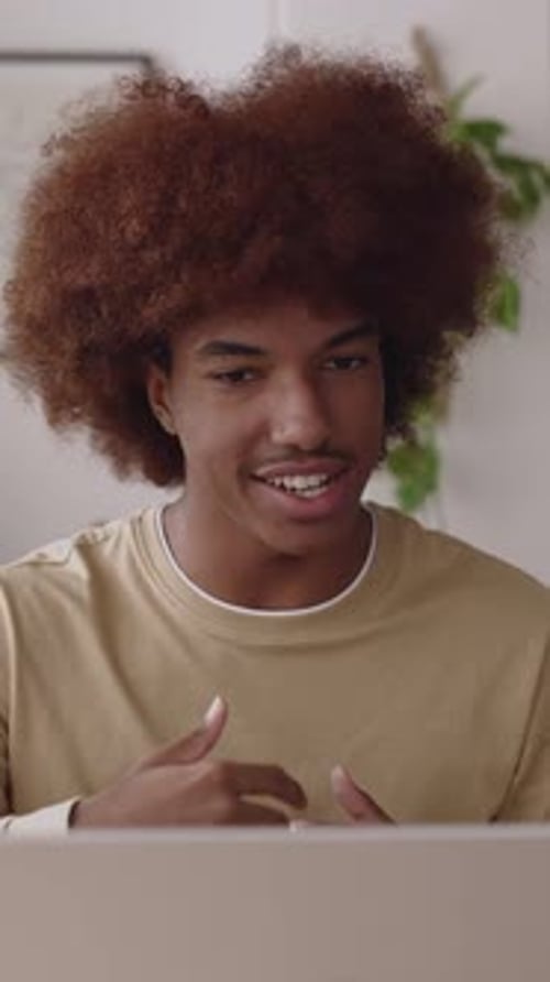 Young Adult on Video Call, Indoors, Vertical Format