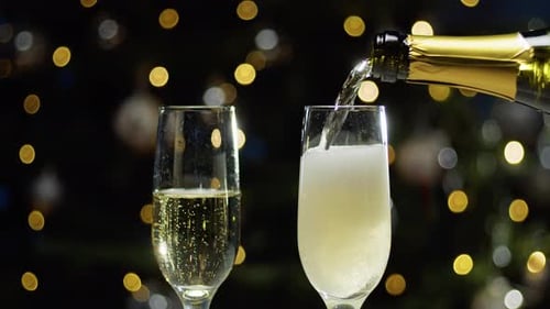 Pouring Champagne into Glass for Celebration