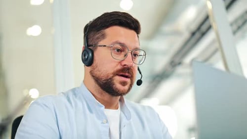 Customer Service Representative Working at Computer