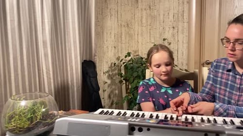 Girl and Woman Play Electronic Keyboard Together