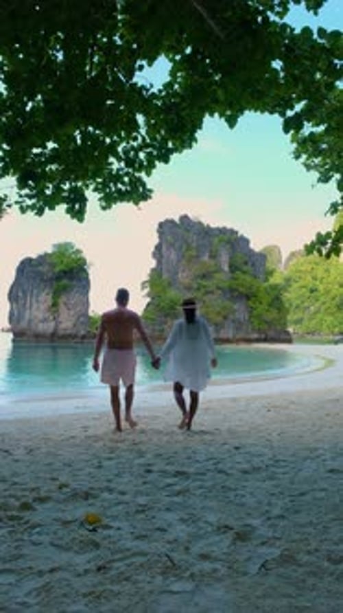 Couple Men and Women on a Tropical White Beach in Thailand Koh Hong Island Krabi